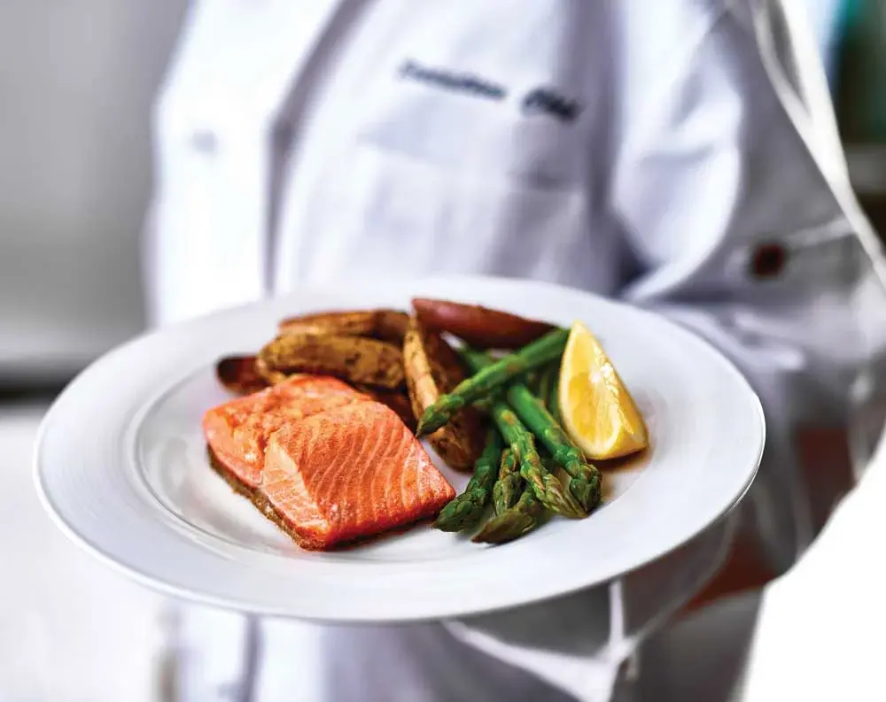 Springwood Landing Chef Created Meals, chef delivering a finished dish.