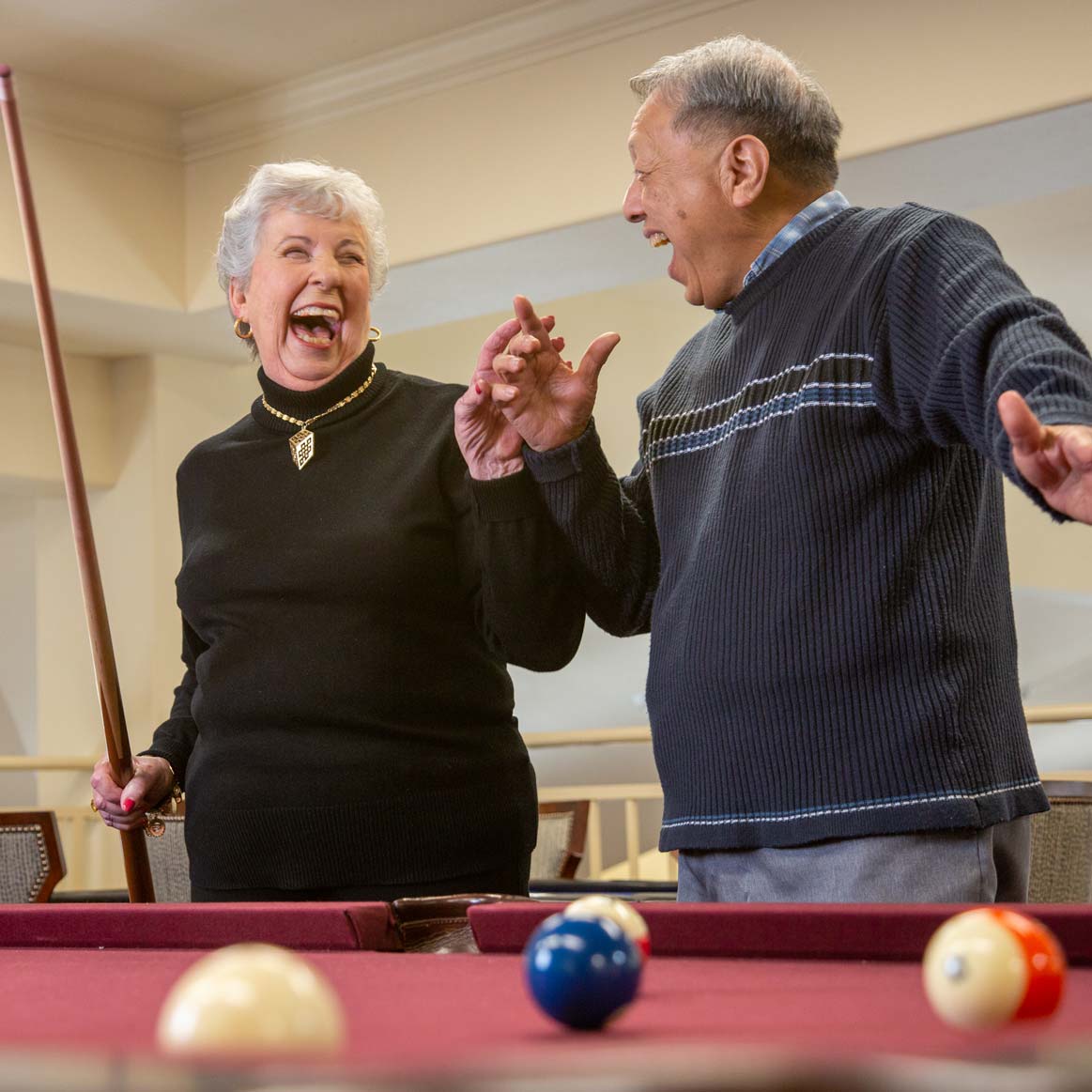 Residents playing billiards at Springwood Landing